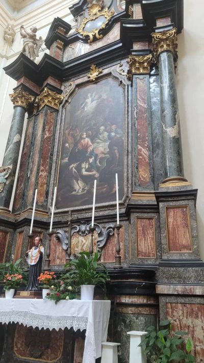 The ornate marble altar inside the church of San Bernardino alle Ossa in Milan