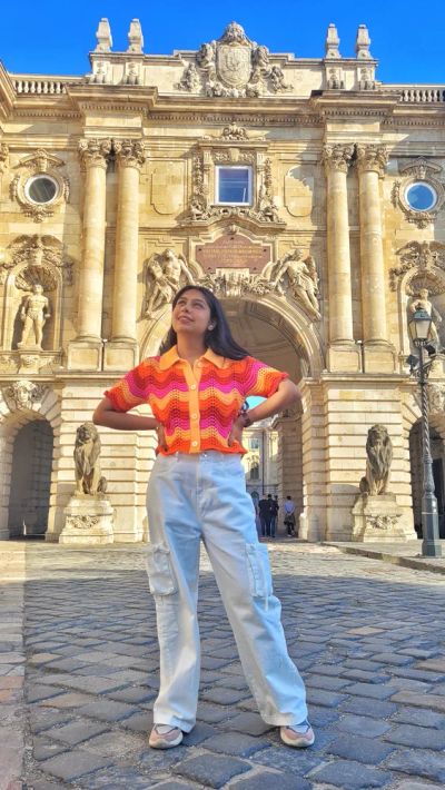 Traveler Jyoti at the Buda Castle gate in Budapest, Hungary