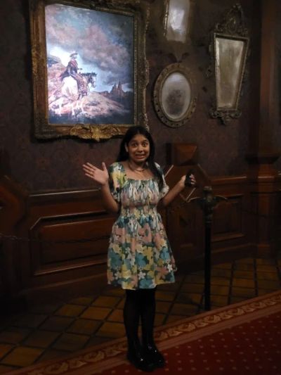 Traveler Jyoti inside the spooky Phantom Manor haunted house at Disneyland Paris