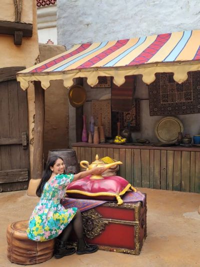 Traveler Jyoti reaching for the magic lamp at Aladdin's bazaar in Adventureland, Disneyland Paris
