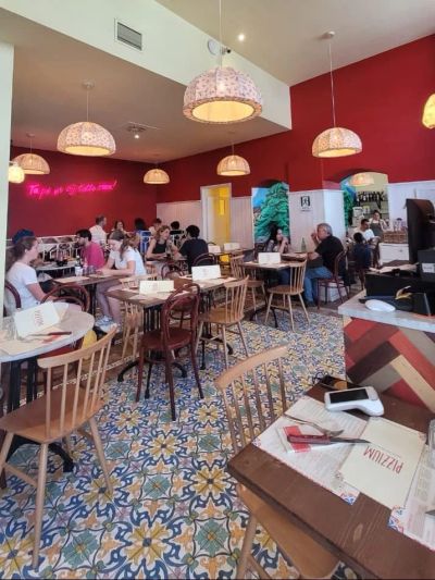 The colourful tiled interior of Pizzium pizzeria in Milan